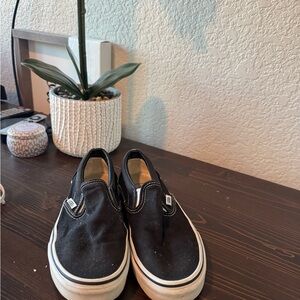 Vans Black and White Slip-On Sneakers
